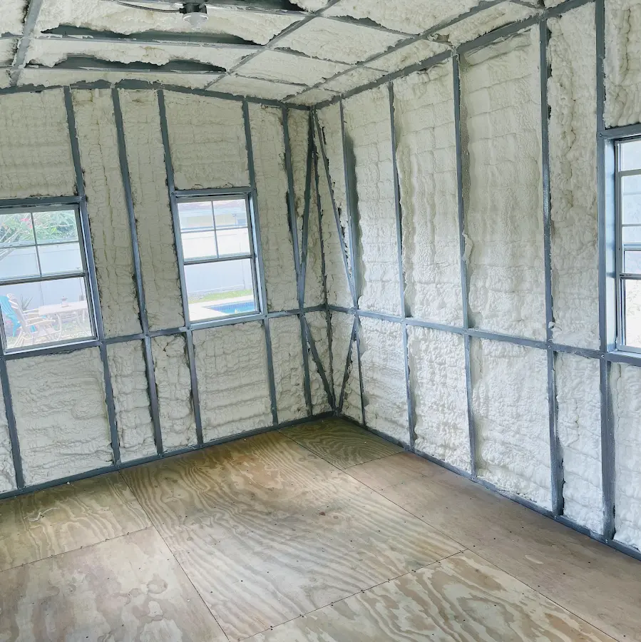 Closed-cell spray foam insulation applied to wall cavities in a residential project in Decorah